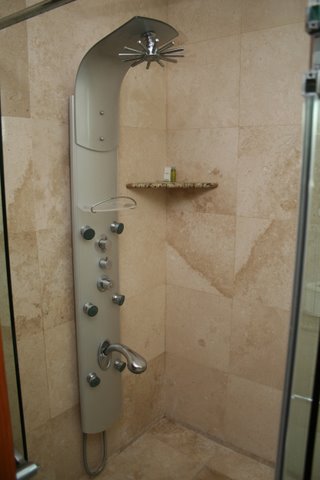 contemporary bath huge shower with frameless doors and fine porcelian tile
