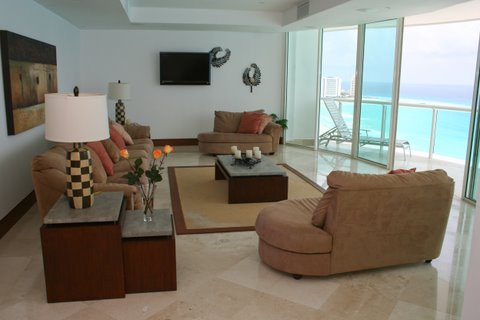 Another view of the extra large great room with contemporary furniture, ocean view