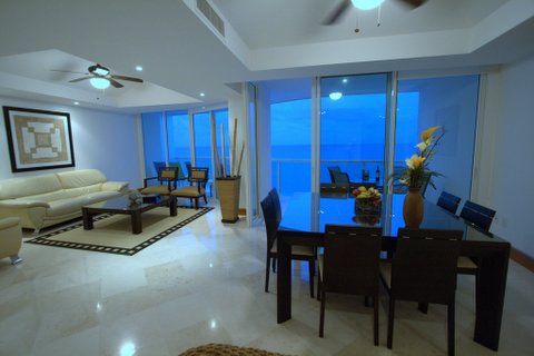 Another view of the extra large great room with contemporary furniture, ocean views