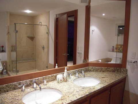 contemporary bath huge shower with frameless doors and fine porcelian tile