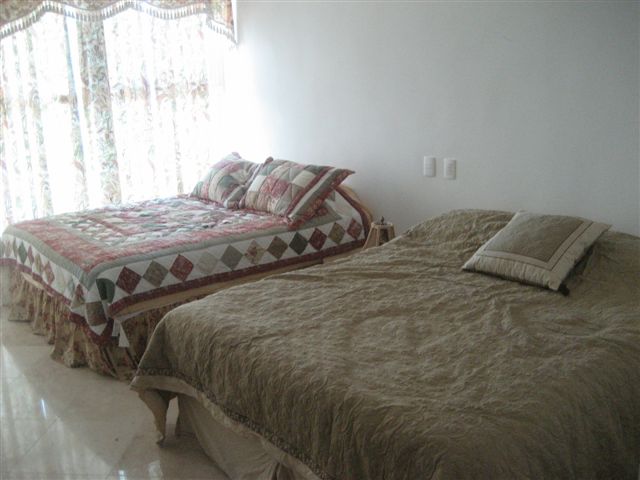 Bedroom #2 offers 2 full size beds, and attached bath, walk in closet, and 32 inch lcd tv