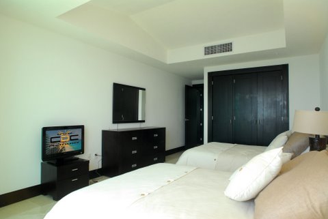 Guest suite 3 with city view terrace, full bath, walk in closet and 32 inch lcd tv