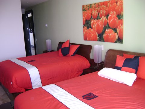 Guest suite 3 with city view terrace, full bath, walk in closet and 32 inch lcd tv