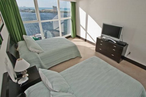 Bedroom #2 offers 2 full size beds, attached full bath, Lagoon views