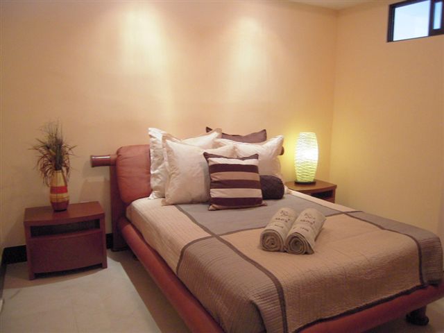 Bedroom 3 offer a queen size bed, sliding mirroed door closet with built in drawers and shelves, and 32 inch lcd tv