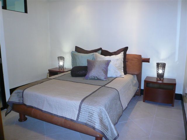 Bedroom 3 offer a queen size bed, sliding mirroed door closet with built in drawers and shelves, and 32 inch lcd tv