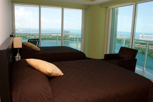 Guest suite 4 with lagoon and ocean view terrace, full bath, walk in closet and 32 inch lcd tv