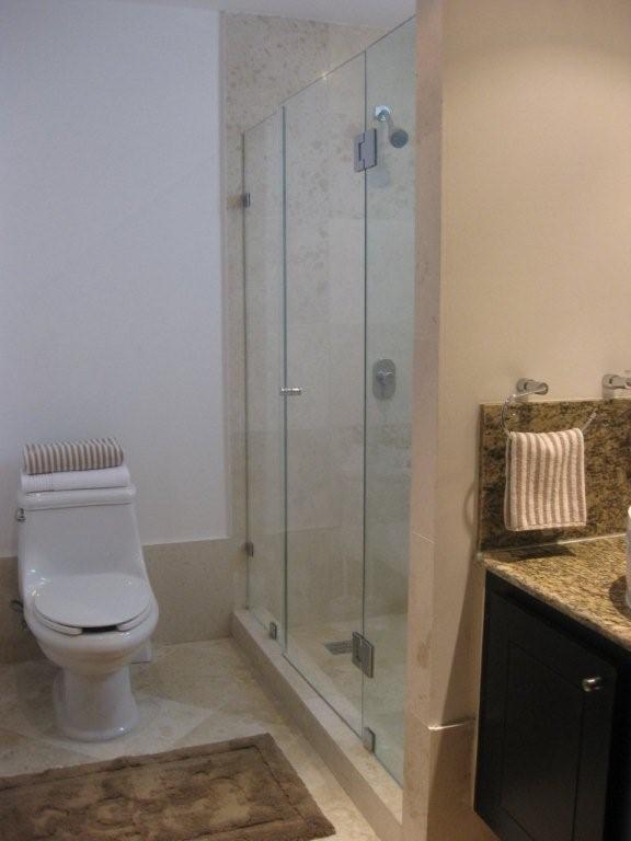 ultra luxury bathroom with sit down shower, granite conters, and fine porcelain tiles