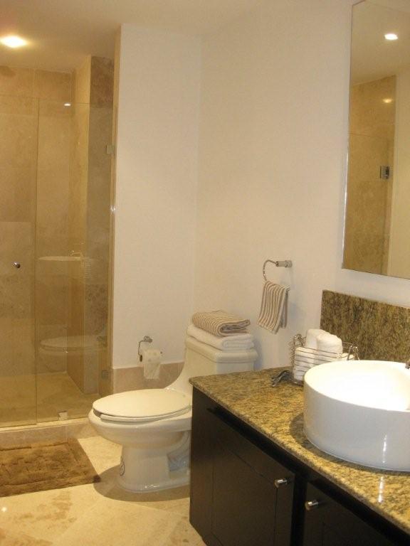 contemporary bath huge shower with frameless doors and fine porcelian tile